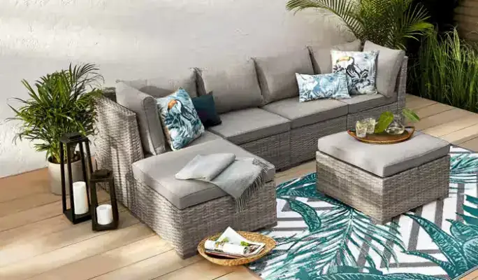 Modern blue and grey outdoor lounge set with patterned pillows