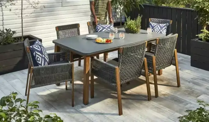 Modern outdoor dining table with high-back chairs