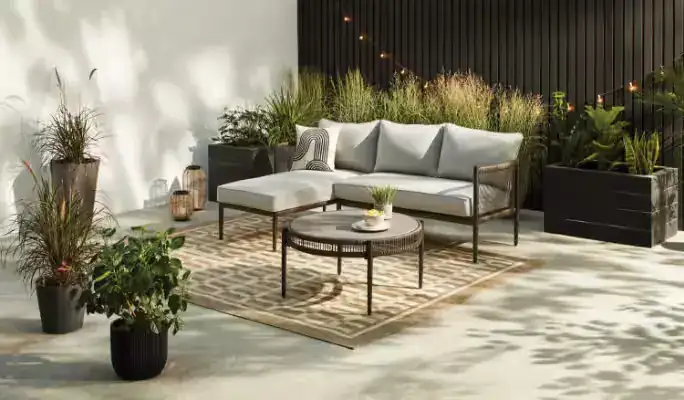 Brown wicker outdoor seating arrangement on patio