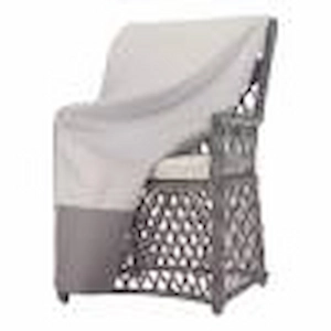 Protective outdoor furniture cover draped over patio chair